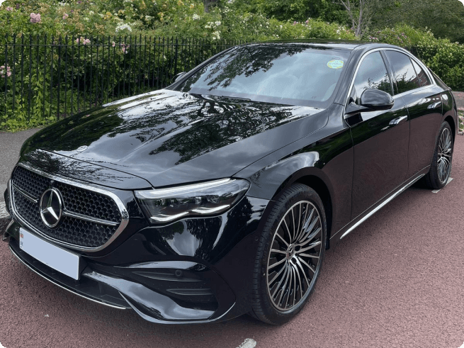 Front three-quarter view of a black Mercedes-Benz E-Class