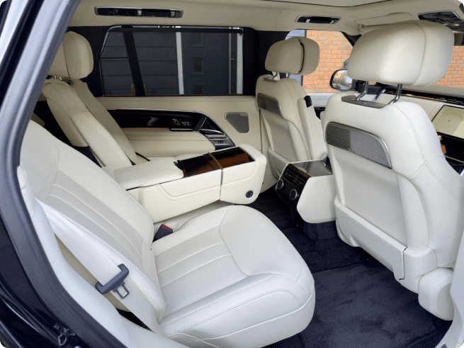 Rear passenger interior of a Range Rover with leather seats