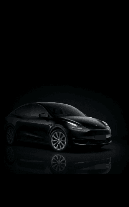 Tesla Y chauffeur car in a dark studio setting