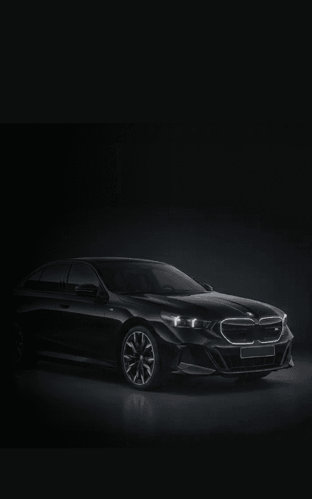 BMW 5 Series chauffeur car in a dark studio setting