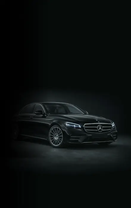 Mercedes-Benz E-Class chauffeur car in a dark studio setting